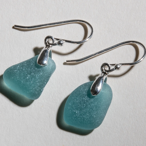 Small deep teal sea glass earrings made with sterling silver bales and ear wires