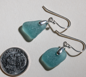 Small deep teal sea glass earrings made with sterling silver bales and ear wires