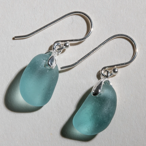 Small dangles of teal sea glass earrings made with sterling silver bales and ear wires