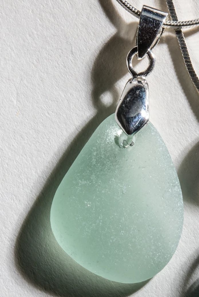 Large, Sea-Foam Green sea glass suspended elegantly in a simple sterling setting on a 24 inch sterling silver chain