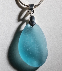 Simple and elegant deep aqua sea glass on a sterling silver bail and 24" sterling silver chain