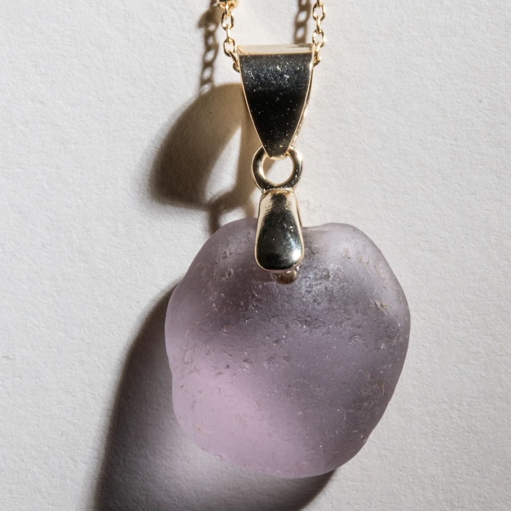 Ultra rare, large purple sea glass in an elegant, simple 14 karat gold over sterling bale.  The chain is 18